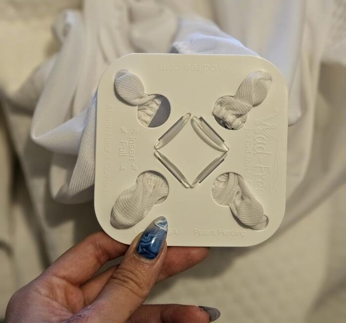 Holder accessory securing shirt sleeves in place, a practical find designed to make your life easier.