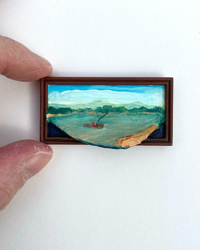 Small nature scene painting with sculptural 3D elements held between fingers by Brooklyn artist.