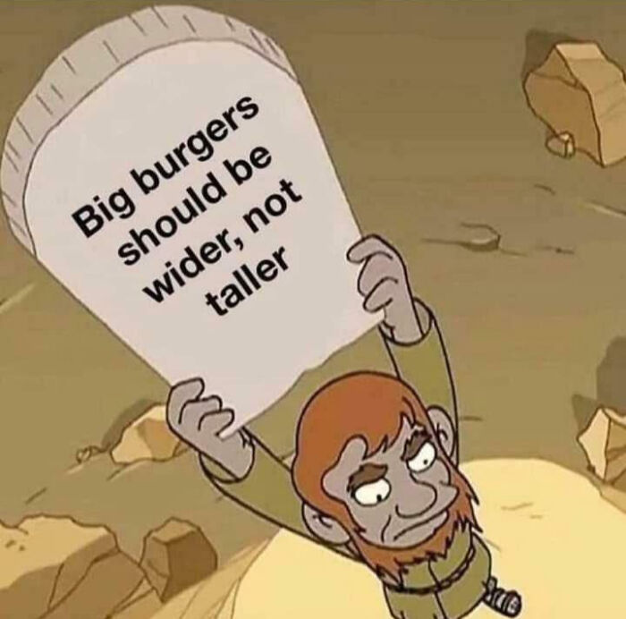 Cartoon character holding a stone tablet with text about burger size, a humorous random Gen-Z meme.