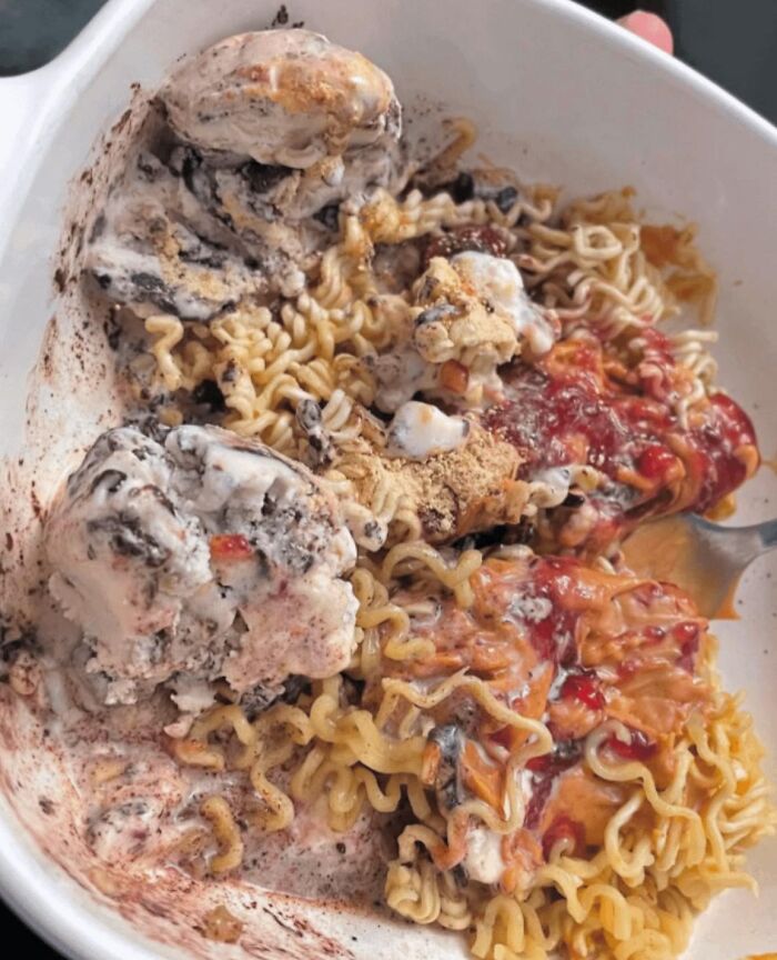 Bowl of instant noodles mixed with melting ice cream and sauce, a disgusting food pic that might ruin your appetite.