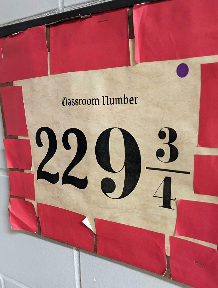 Classroom number sign 229 3/4 creatively displayed with red paper, reflecting teachers showing love for students and chosen profession.