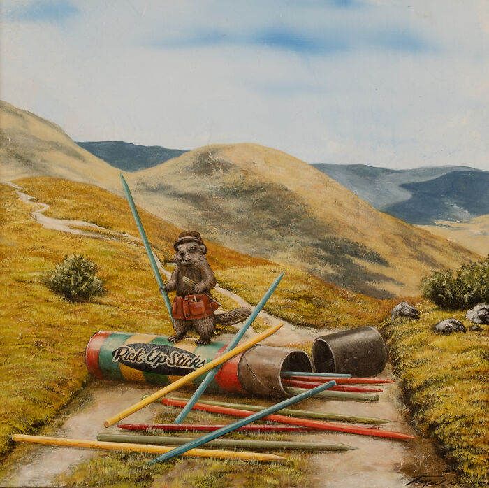 Surreal animal painting of an otter holding sticks near oversized Pick-Up Sticks in dreamy storybook landscape.