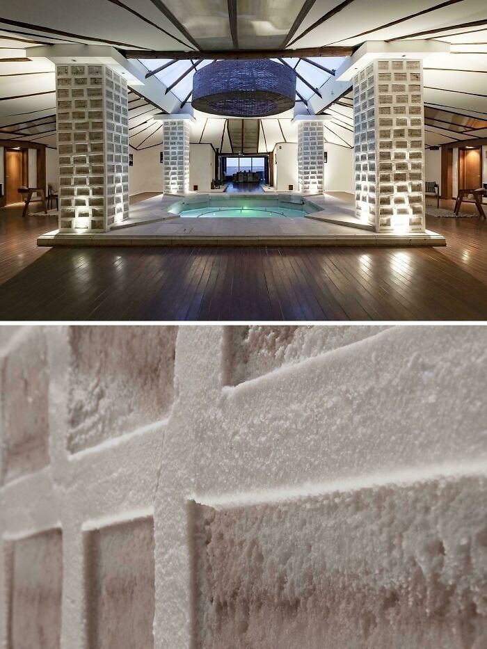 Modern hotel design featuring illuminated glass block pillars around a central spa pool with unique textured wall details.