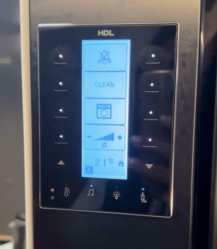 Touchscreen control panel with temperature and music settings, showcasing genius hotel design decisions and modern technology integration.