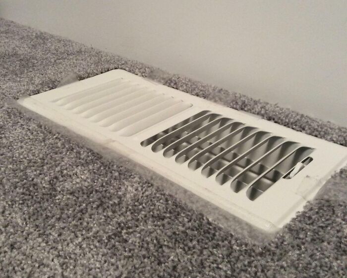 Air vent misplaced on carpet causing a hilariously unlucky parenting home maintenance fail.