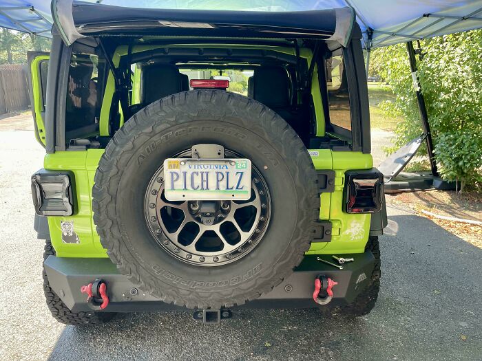 Green jeep with a Virginia license plate reading PICH PLZ, showing a humorous example of hilariously unlucky parents.