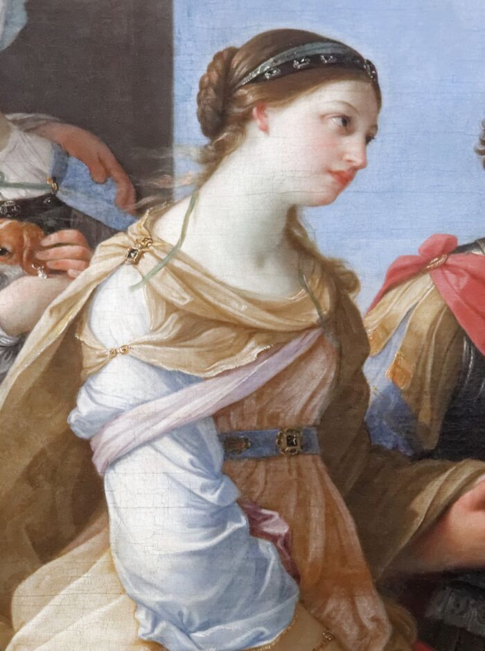Portrait of a young woman in classical attire, illustrating famous names from history known for their good looks.