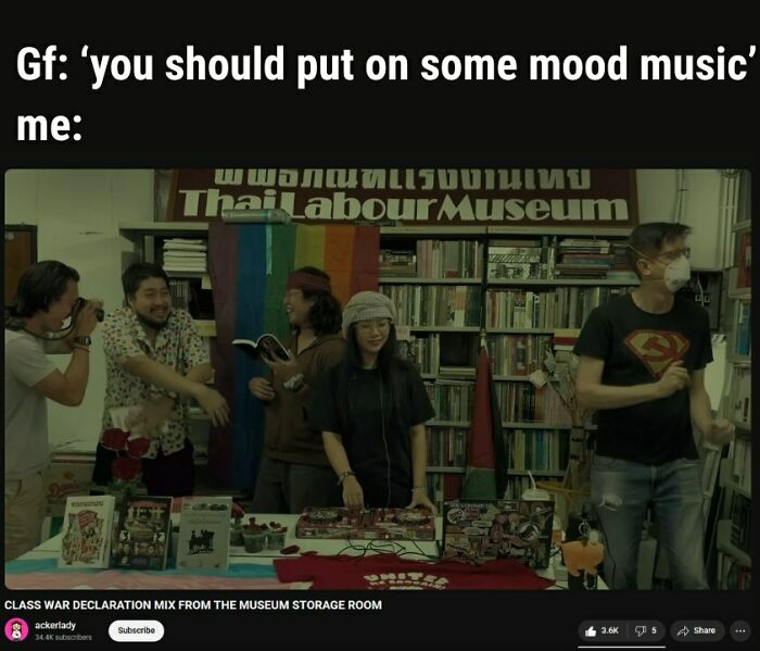 Group of people having fun indoors with music and books, illustrating powerful memes that are both hilarious and eye-opening.