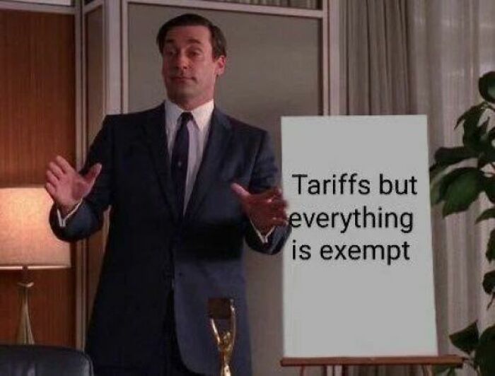 Man in suit presenting a meme about tariffs while sharing powerful memes that are hilarious and eye-opening in a Facebook group.