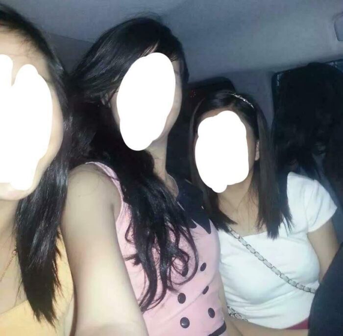 Three young women inside a car, dimly lit, resembling a chilling ghost encounter captured at night.