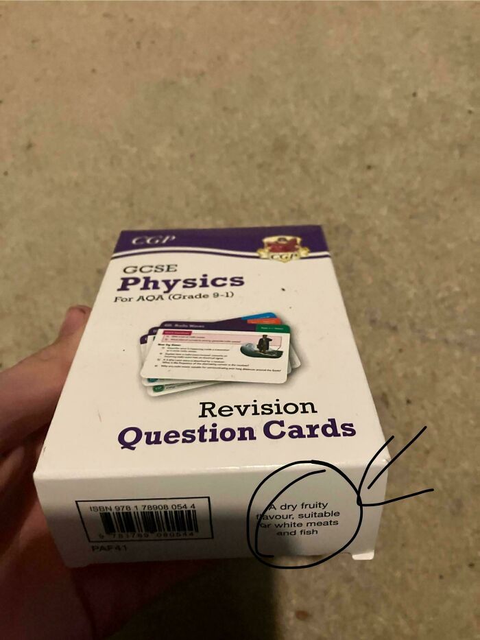 Box of GCSE Physics revision question cards with a humorous confusing label about dry fruity flavor on the packaging.