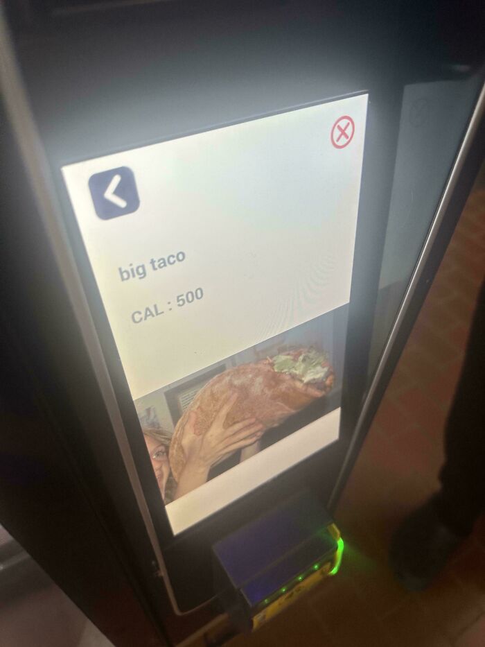 Vending machine screen showing a confusingly large taco labeled big taco with 500 calories in a funny pic.