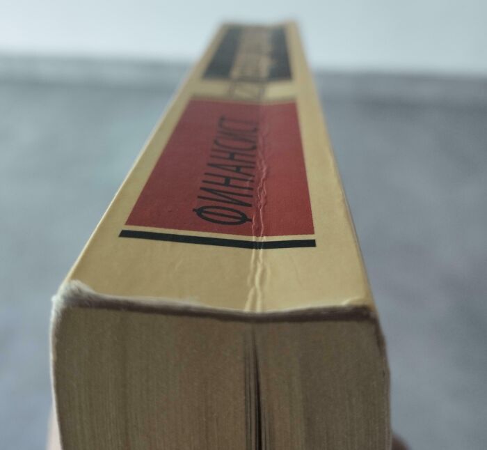 Close-up of a damaged book spine highlighting infuriating pics of people damaging things they borrowed.