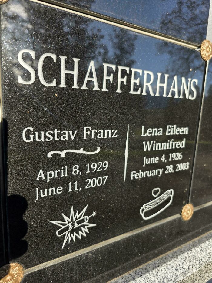 Tombstone with unusual icons, a lightning bolt and a hot dog, creating a funny and confusing picture moment.