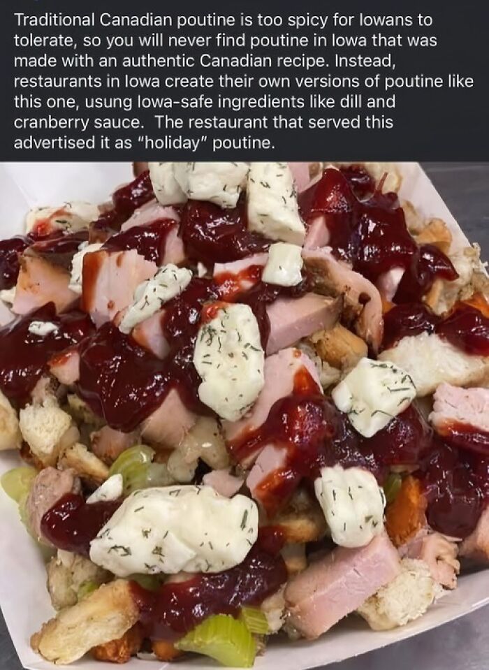 Holiday poutine with dill, cranberry sauce, and chunks of meat on fries, an unusual dish from Iowa restaurants.
