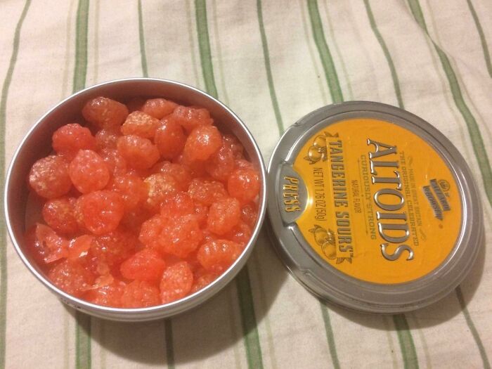 Tin of discontinued Tangerine Sour Altoids candies, a beloved food that broke hearts when it disappeared.
