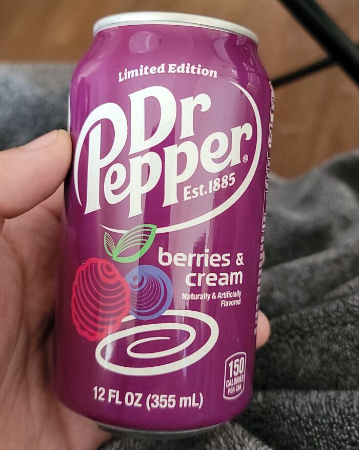 Limited edition Dr Pepper berries and cream soda can held by hand, nostalgic beloved foods and drinks that disappeared.