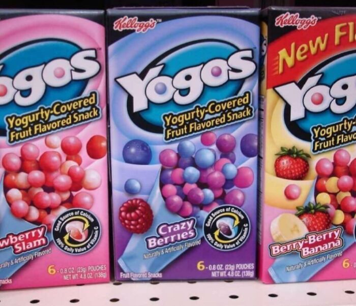 Boxes of Yogos yogurt-covered fruit flavored snacks in Strawberry Slam, Crazy Berries, and Berry-Berry Banana flavors, nostalgic foods.