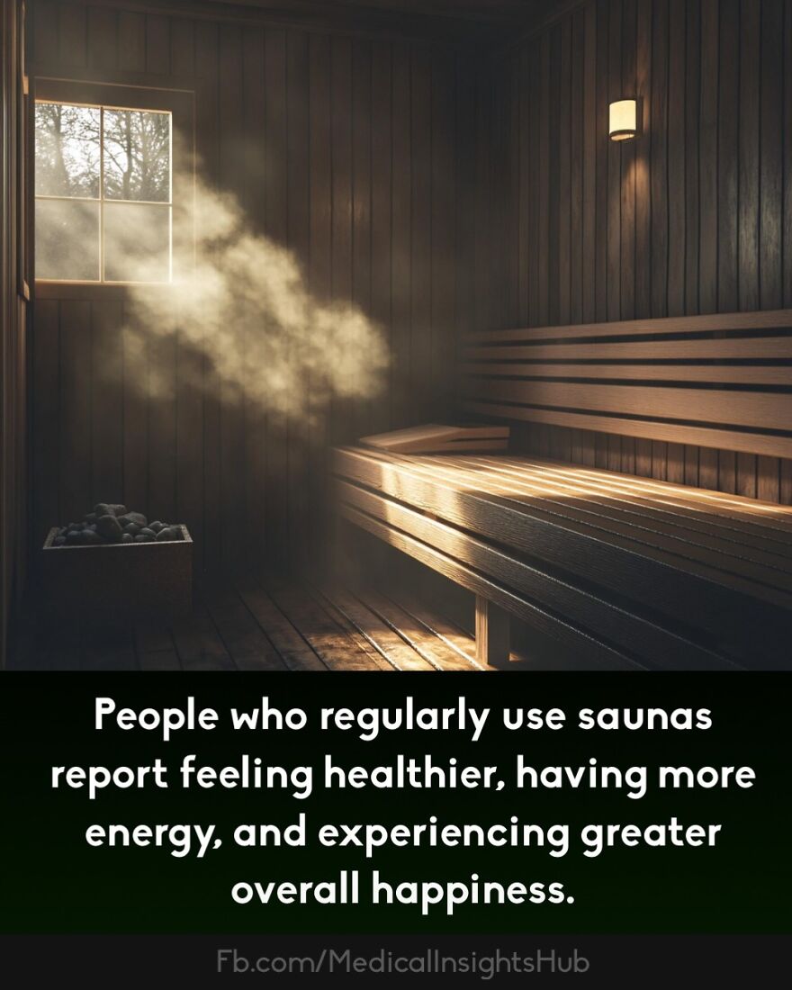 Interior of a wooden sauna with sunlight streaming through the window, highlighting steam in the air and wooden benches.