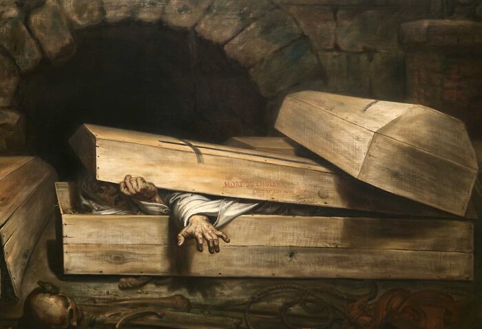 A person trapped inside a wooden coffin with hands reaching out, illustrating eerie and unsettling Wikipedia articles.