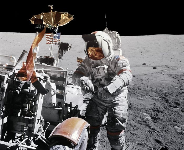 Astronaut in spacesuit conducting lunar exploration with equipment on the moon showcasing bizarre astronaut facts.