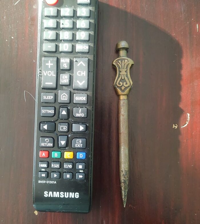 Vintage decorative metal spike found among unexpected things hidden in walls and other hidden places in homes.