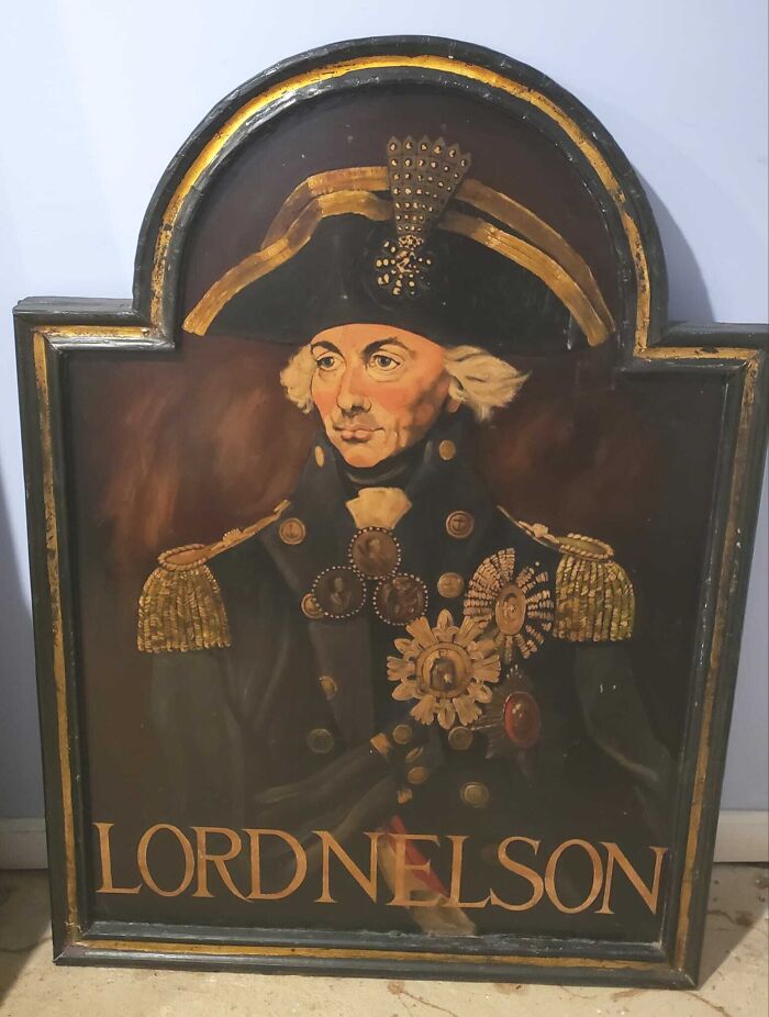 Antique Lord Nelson painting, one of the unexpected things found in walls and hidden places in homes.