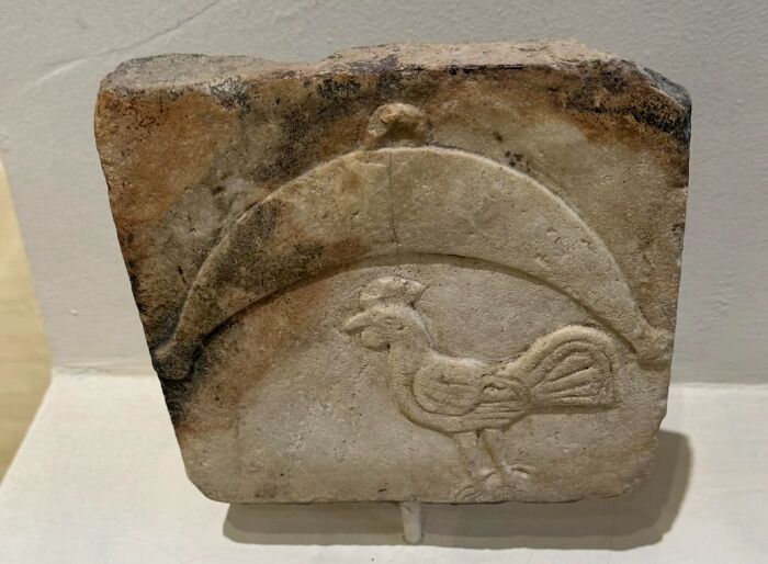 Carved stone slab with a rooster relief, an unexpected thing found hidden in walls and homes.