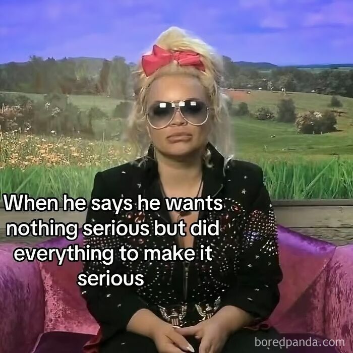 Woman with sunglasses and a red bow sitting on a purple couch, illustrating relatable memes capturing the chaos of navigating life.