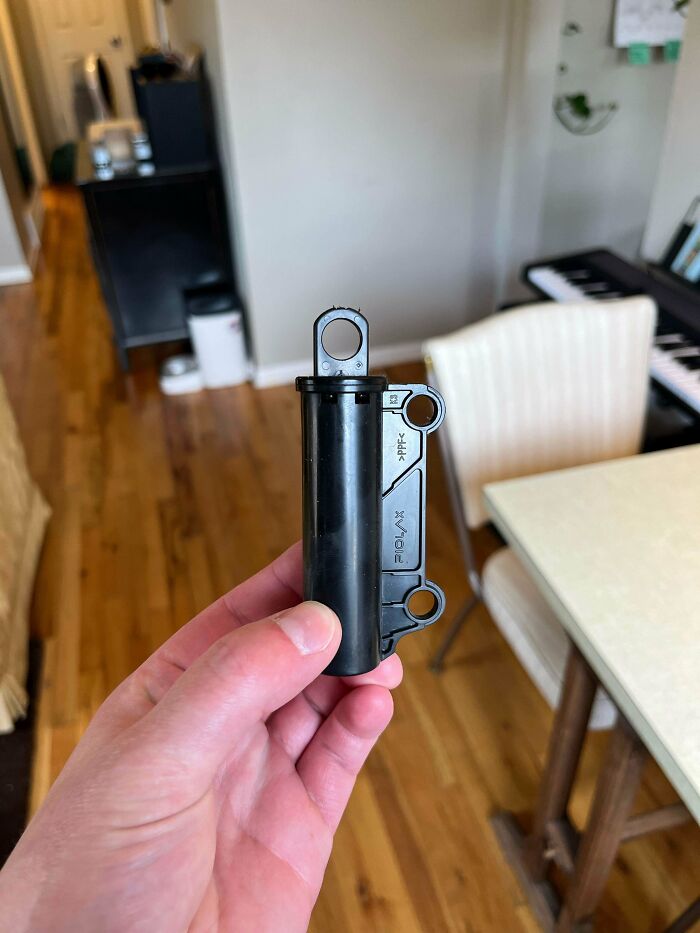 Hand holding a mystery object indoors, an example from the online group helping folks recognize unknown items.