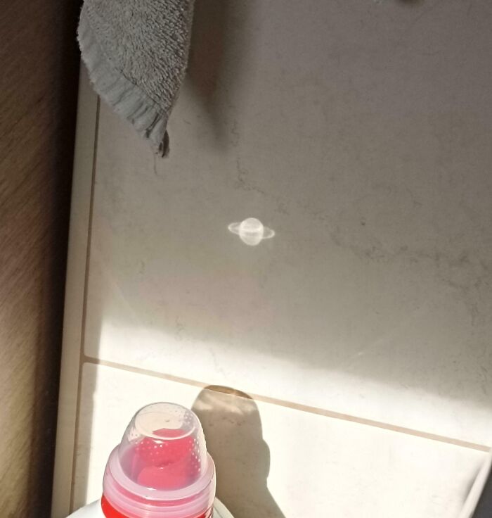 Reflection on the floor resembling planet Saturn, one of the interesting things that required a double take to realize.