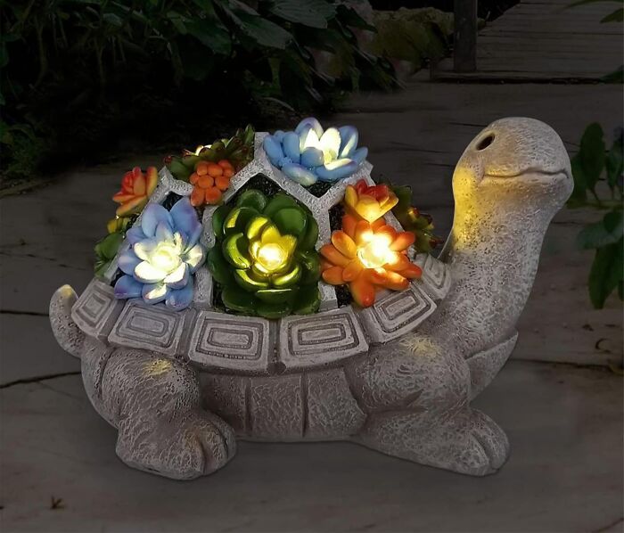 Turtle-shaped outdoor decorative light with colorful succulent-inspired LED lights enhancing nighttime garden spaces