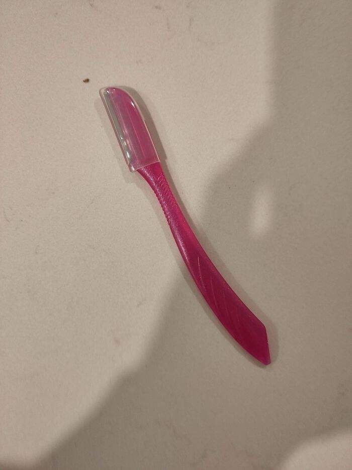 Small pink mystery object with a clear cap, featured among recognized mystery objects in an online group.