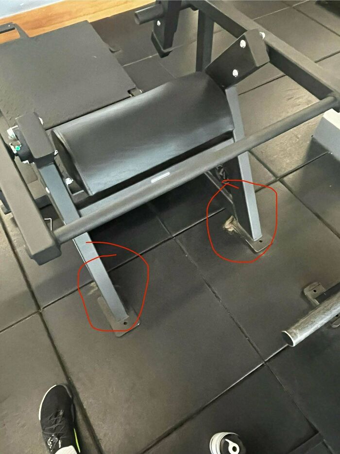 Gym equipment with missing bolts circled in red on black padded flooring, mystery objects identified by online group.