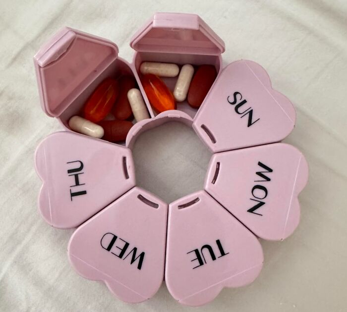 Heart-shaped weekly pill organizer with vitamins and capsules, a seriously sweet discovery to inject a major dose of aww.