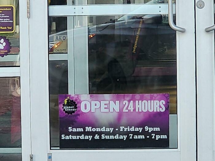 Planet Fitness gym entrance with a sign showing open 24 hours and weekend gym hours for annoying gym moments.