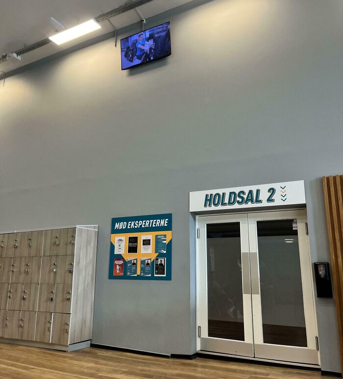Locker area and closed gym room doors inside a fitness center, illustrating common annoying gym moments.