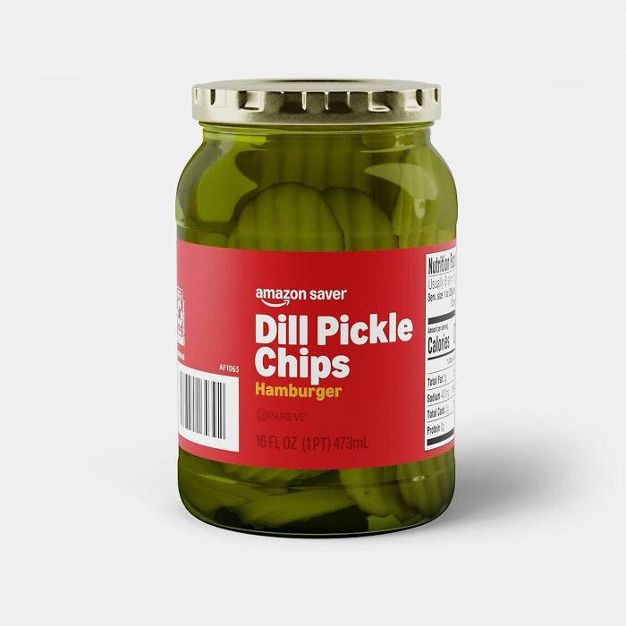 Jar of Amazon Fresh dill pickle chips on a white background, highlighting Amazon Fresh staples cheaper than big box stores.