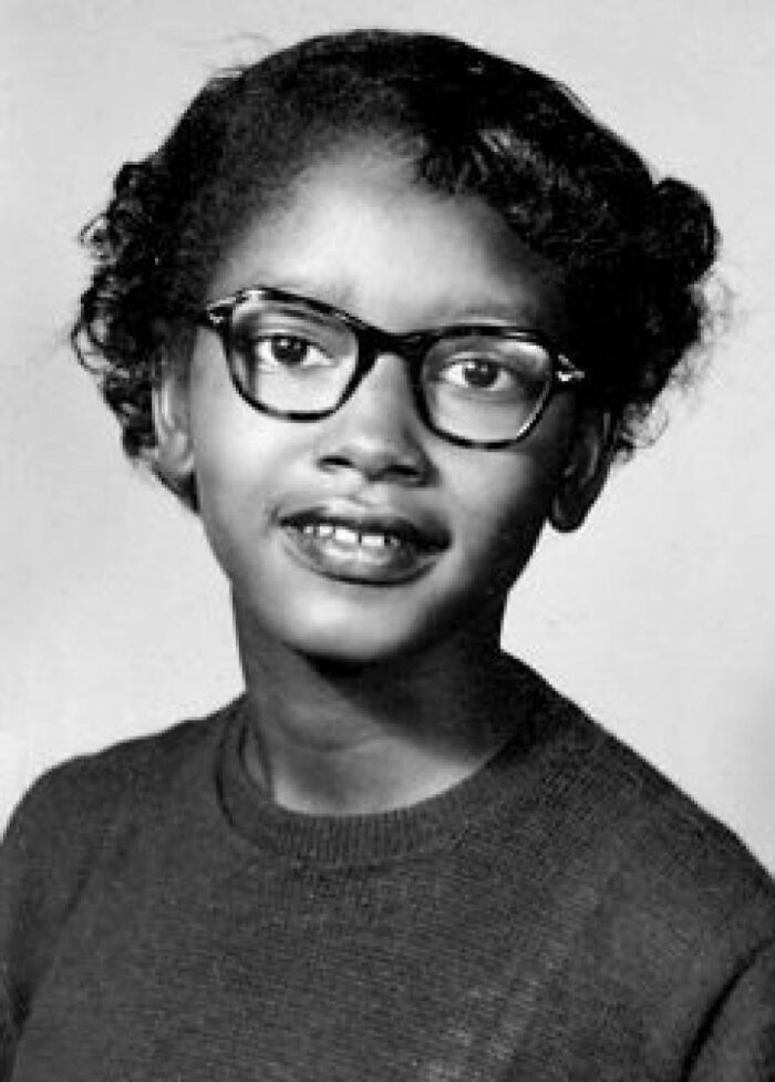 Young woman with glasses and curly hair in a black and white photo representing historical events that don’t get enough attention.