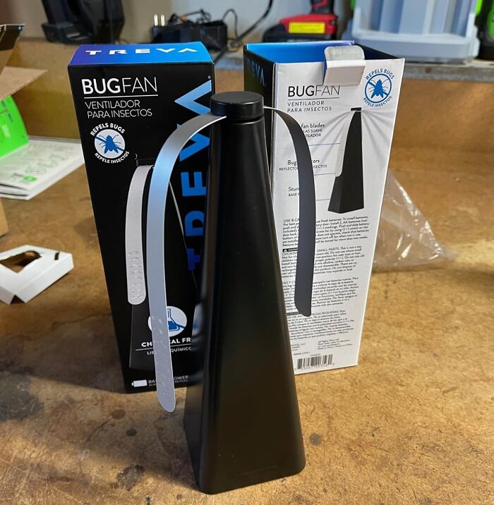 Chemical-free bug repellent fan on a table next to packaging boxes showcasing clean and simple pest control.