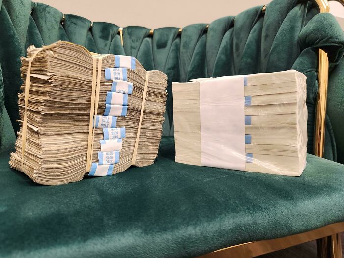 Comparison pic showing two stacks of money with notable variety in condition and packaging on a green velvet couch.