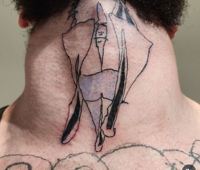 Abstract and poorly drawn tattoo on the back of a neck showing a distorted figure, an example of hilariously bad tattoos.