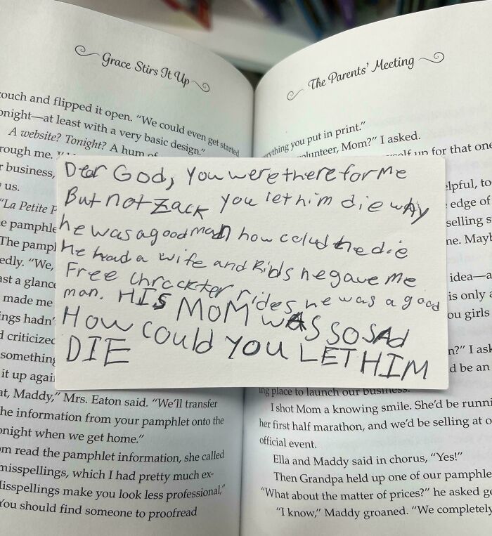 Handwritten note found inside a book, a historical memento expressing grief over a loved one's death.