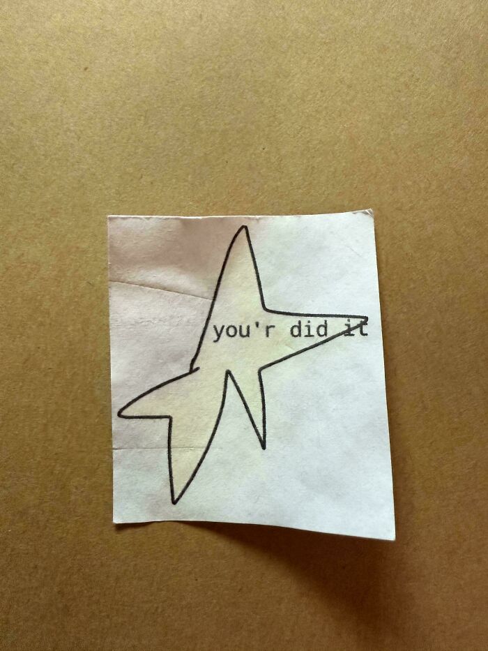Old paper with a hand-drawn star and a typed message saying "you'r did it," a unique historical memento found randomly.