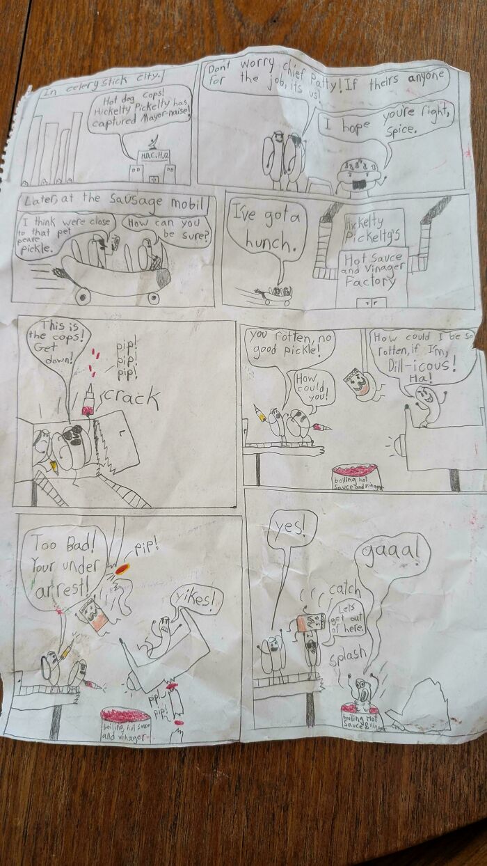 Hand-drawn comic strip on paper with characters and text, a unique historical memento people randomly found on wood table.