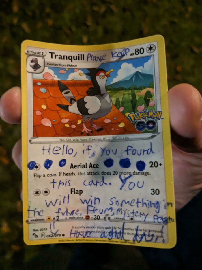 Hand holding a Pokemon card with a handwritten mysterious message, one of the historical mementos people found.