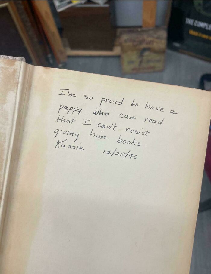 Handwritten note inside a vintage book, dated 12/25/40, as a historical memento randomly found from the past.