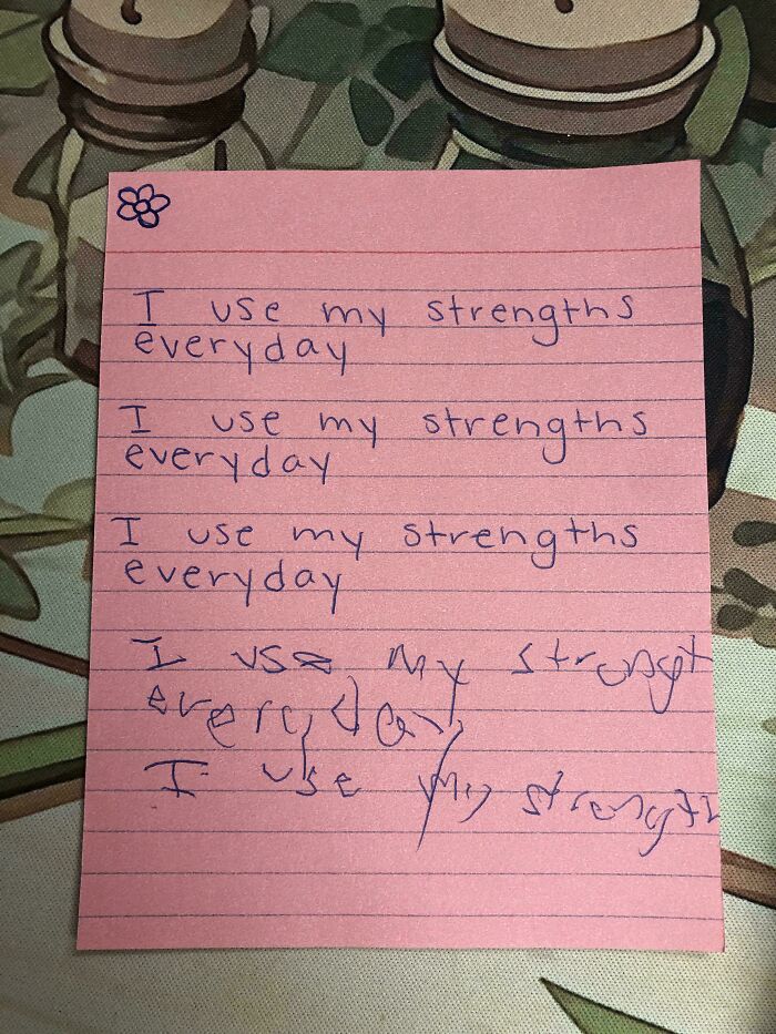 Pink handwritten note repeatedly stating I use my strengths everyday, a historical memento people randomly found.