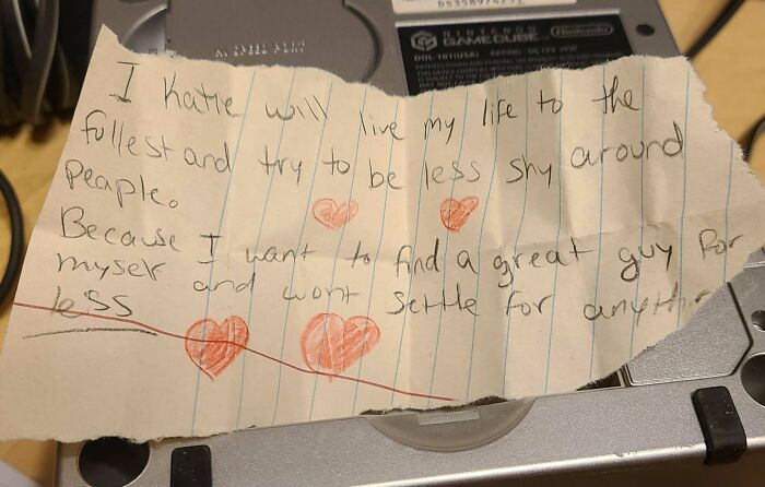 Handwritten note found among historical mementos expressing personal goals and aspirations with red heart drawings.