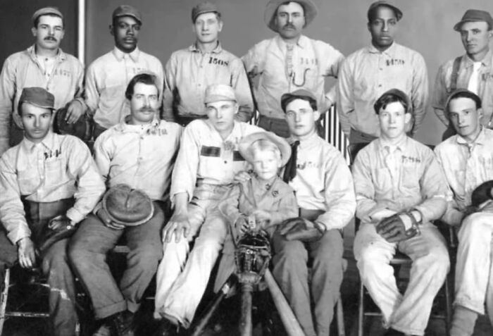 Group of men and a young boy in early 20th-century baseball uniforms illustrating weird things about history.